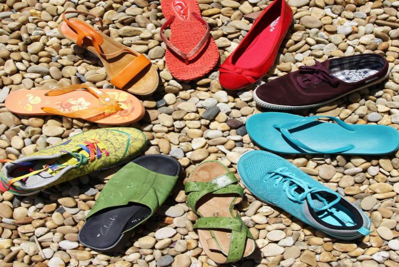 Circle Of Shoes On Pebbly Beach