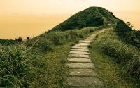 Charting New Paths Fairy tale landscape and stepping stone path over a hill on the horizon at the Caoling Historic Trail in Taiwan