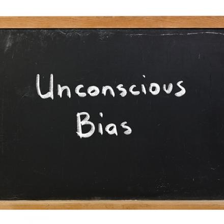 Reflecting on Bias Chalkboard with words: Unconscious Bias